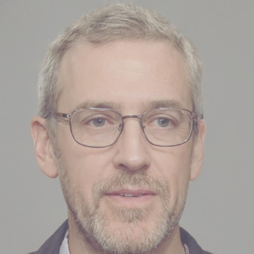 Floral design instructor demonstrating arrangement technique in studio